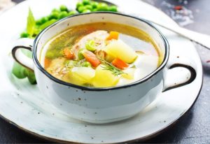 Bowl of chicken and vegetable soup.