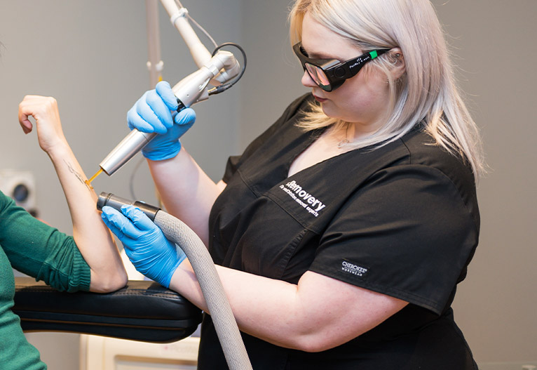 Person having a tattoo removed.