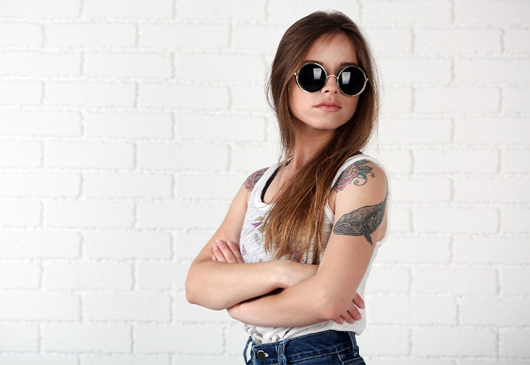 Woman with tattoos on her arms.
