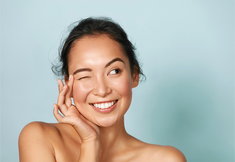 Woman with glowing, dewy skin.