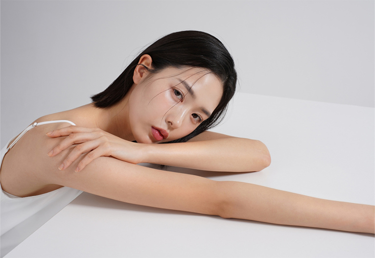 Korean woman with glowing skin.