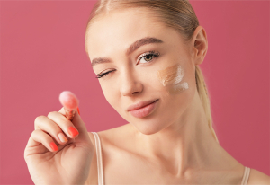 Woman applying foundation.