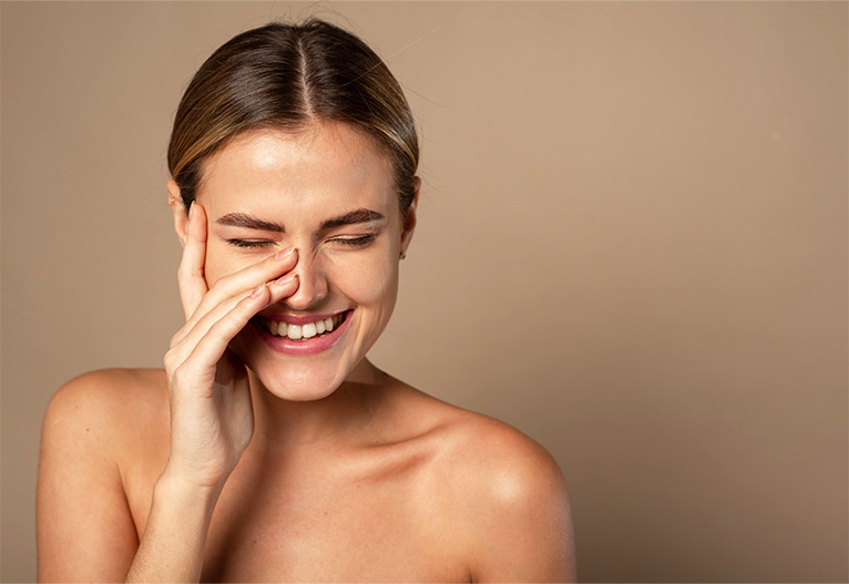 Smiling woman wearing bb cream.