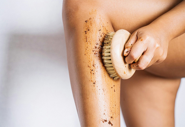 Person exfoliating their leg.