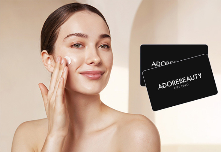 Woman applying cream to her face.