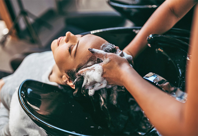 Woman having her hair washed at a salon.