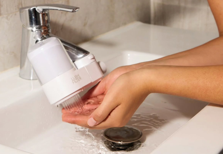 Lushi skincare water filter in use.