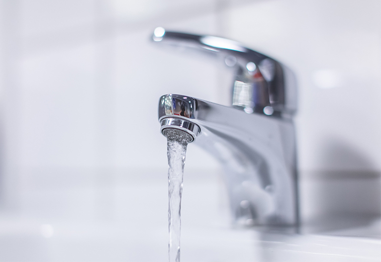 Water running from a bathroom tap.