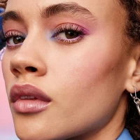 Model wearing Maybelline Sky High Waterproof Mascara.