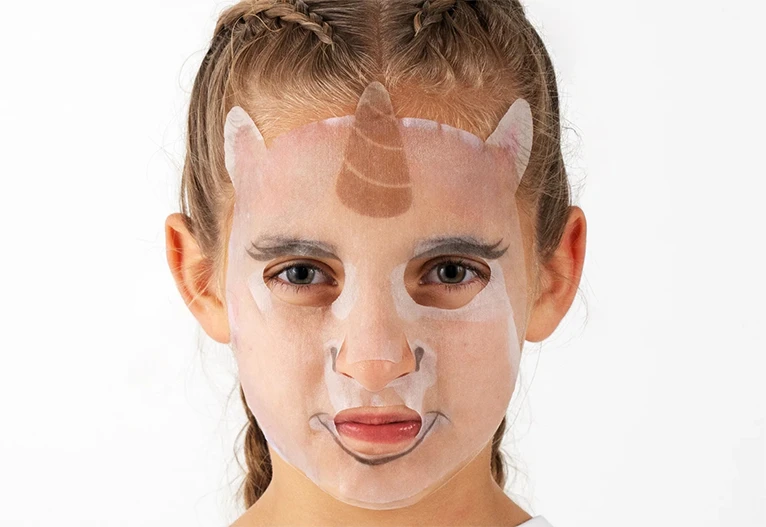 Young girl wearing a Rini face mask.
