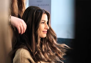 Woman sitting in a chair at a hair salon.