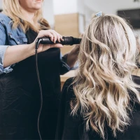 Woman having her hair styled at the salon.