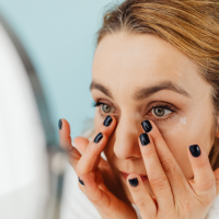 Clinical-grade skincare cream beside online shopping packaging illustrating the risks of buying skincare from unauthorised online sellers.