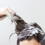 Person washing their hair.